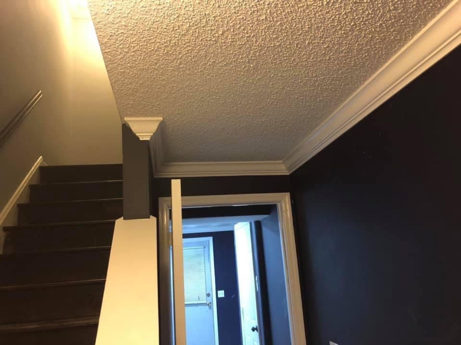 Crown molding and trim in a freshly finished stairwell.