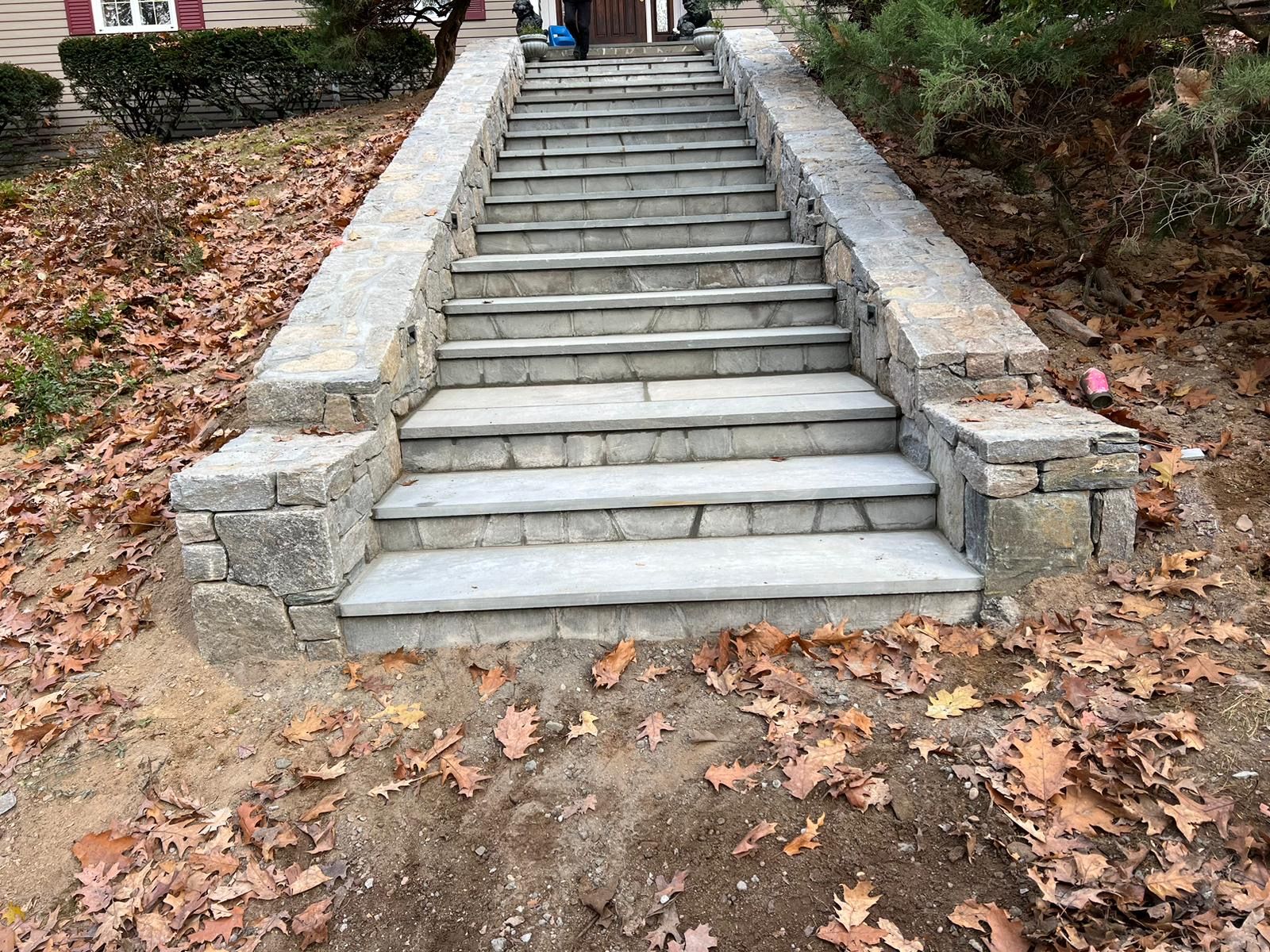 Natural stone steps set into a landscaped hillside.