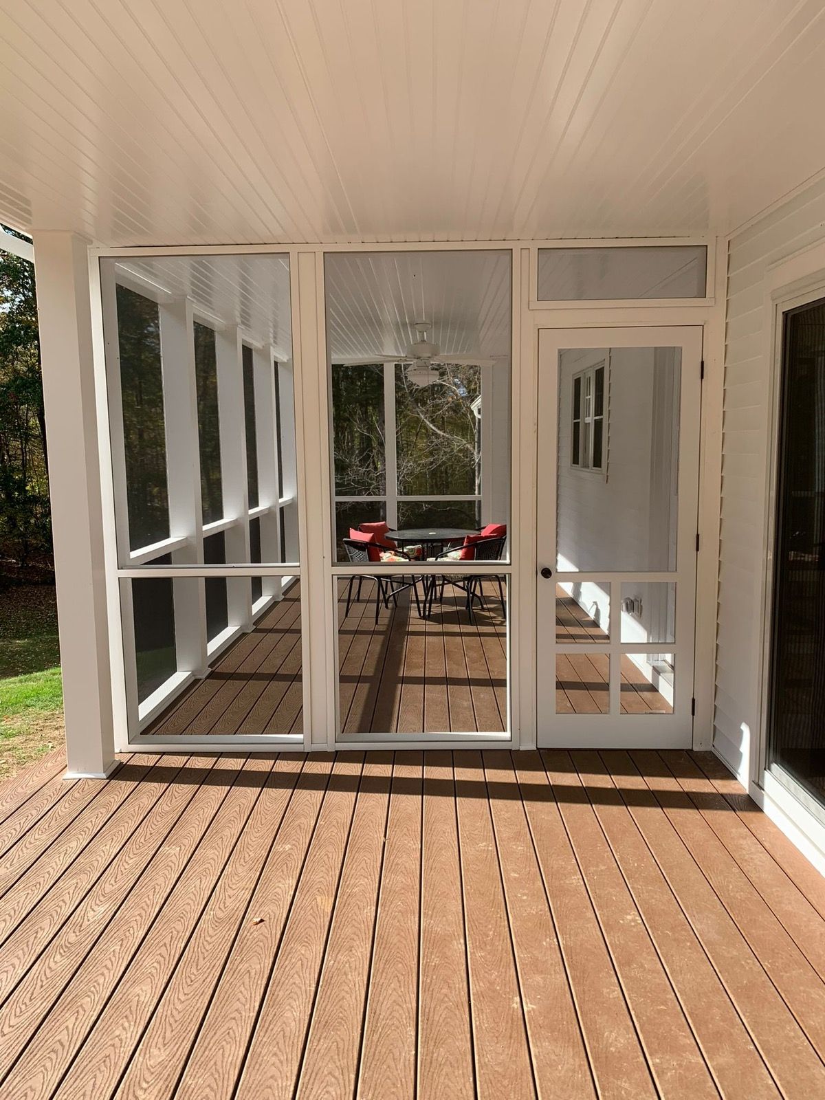 Bright sunroom addition with French doors.